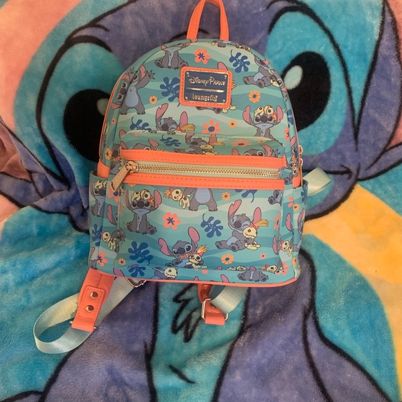 disne parks loungefly mini backpack EARidescent Shimmer 50th (Slight Damage) – Magical Pins & Collectibles and an enamel zipper charm of Scrump tops off the look NEW Fluffy Blue Loungefly Mini